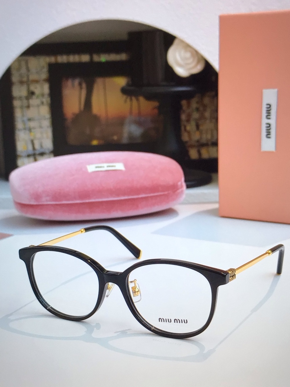Miu Miu Black and Gold Round Women's Eyeglasses